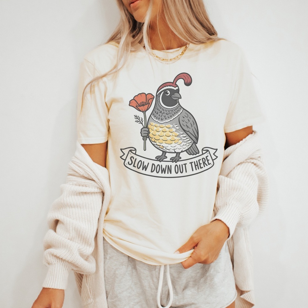Slow Down Out There Quail Holding a Poppy Scroll Banner Tee